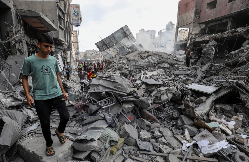 Thousands of bodies lie buried in rubble in Gaza. Families dig to retrieve them, often by hand